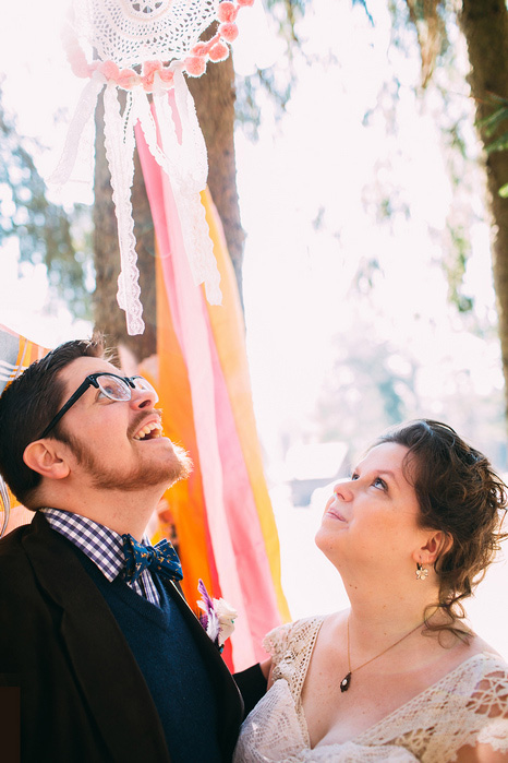 bride and groom looking up