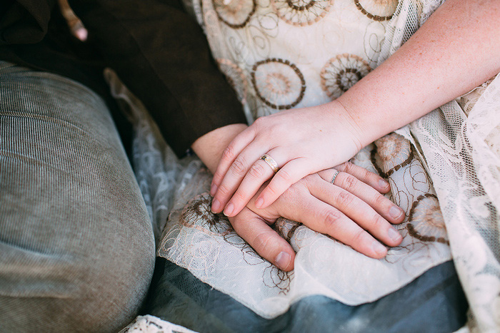 bride's hand on top of groom's