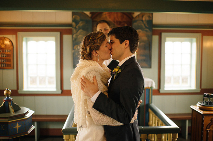 bride and groom first kiss