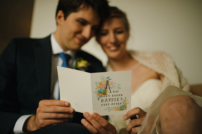 bride and groom reading card