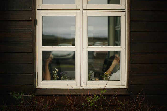 bride and groom in restaurant window