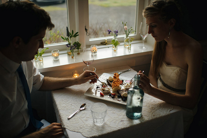 bride and groom eating dinner