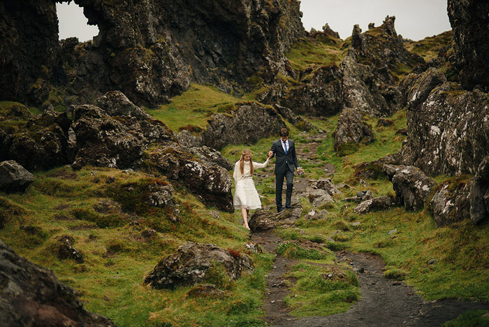 bride and groom walking in Iceland