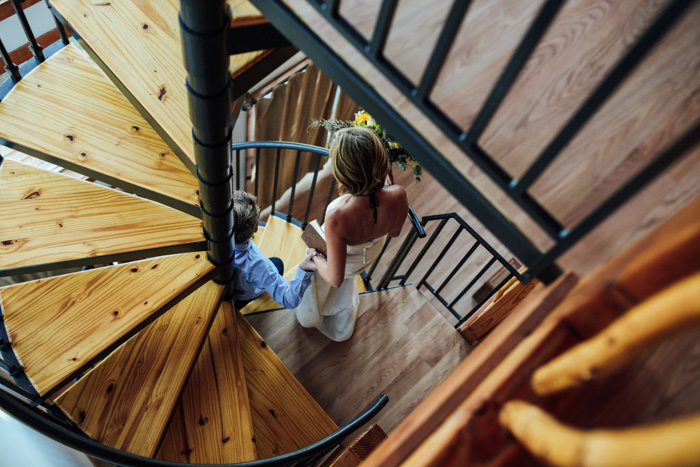 bride walking down spiral staircase