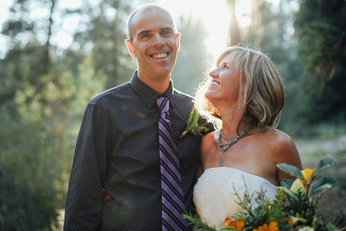 bride and groom in the woods