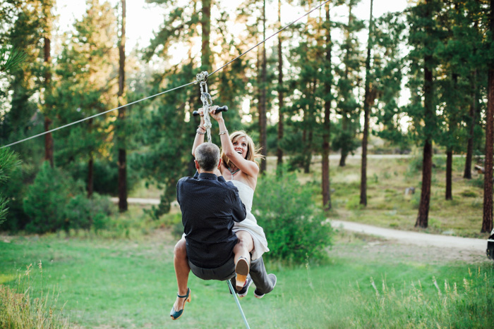 bride and groom zip lining