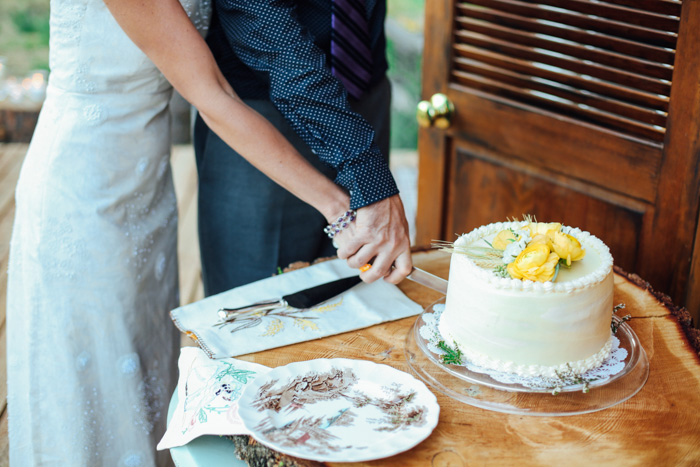 bride and groom cutting cake