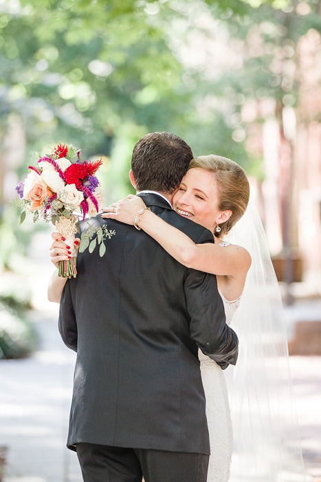 bride and groom hugging at first look