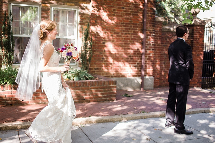 bride walking up behind groom