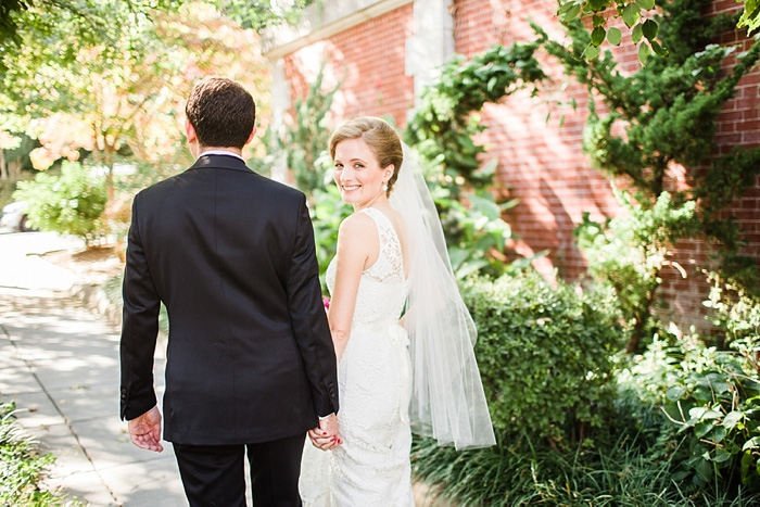 bride and groom walking down street