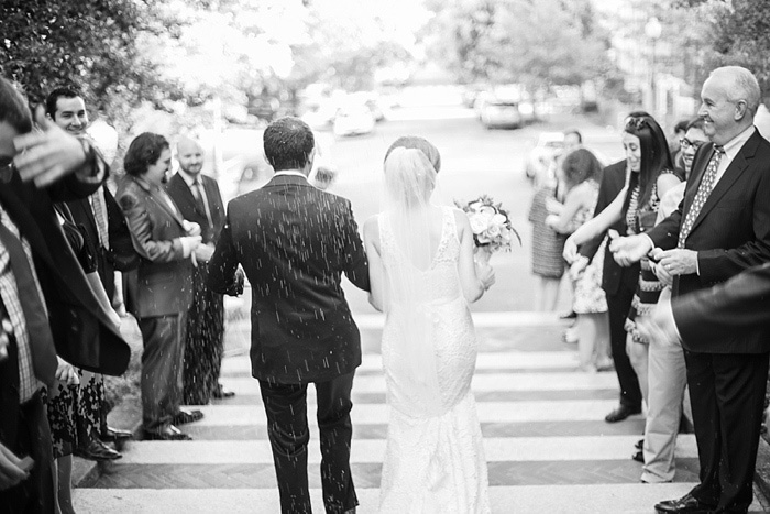 guests throwing rice on couple