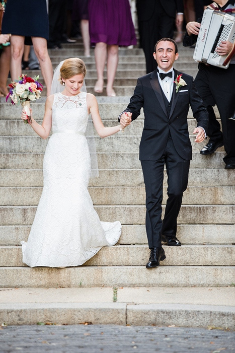 bride and groom walking down steps