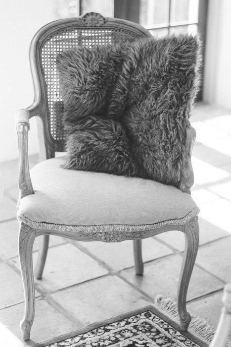 chair with faux fur pillow