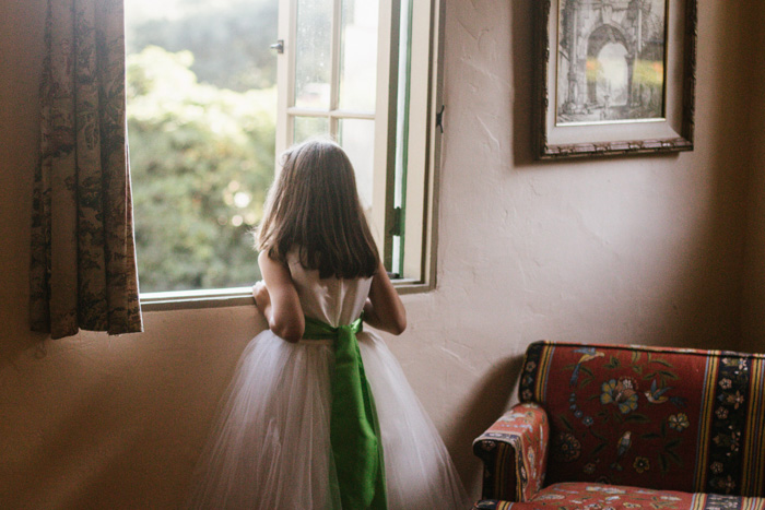 flower girl looking out window