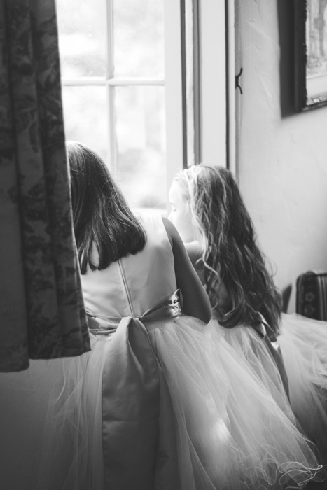 flower girls looking out window