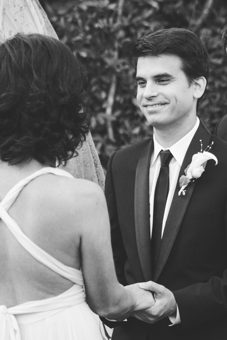 groom looking at bride during ceremony