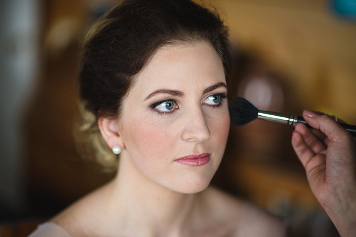 bride getting her makeup done