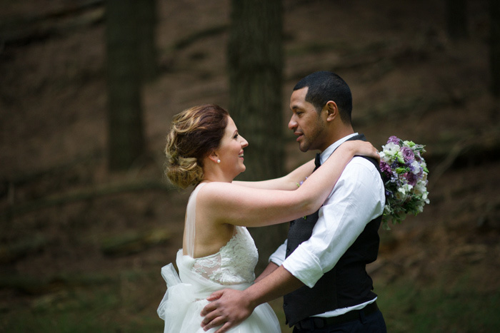 bride and groom hugging