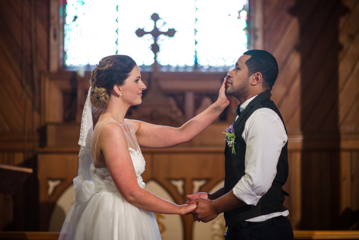 bride wiping away groom's tears