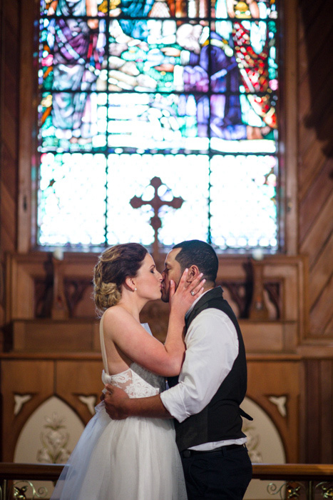 bride and groom first kiss