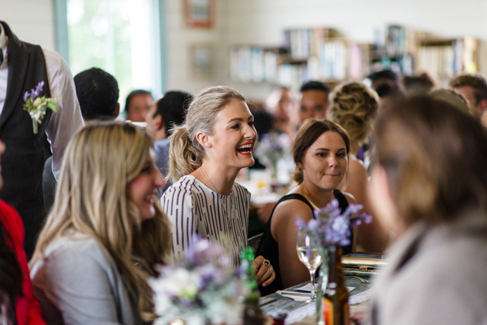 laughing wedding guests