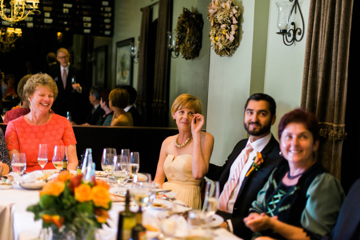 bride wiping away tears at reception