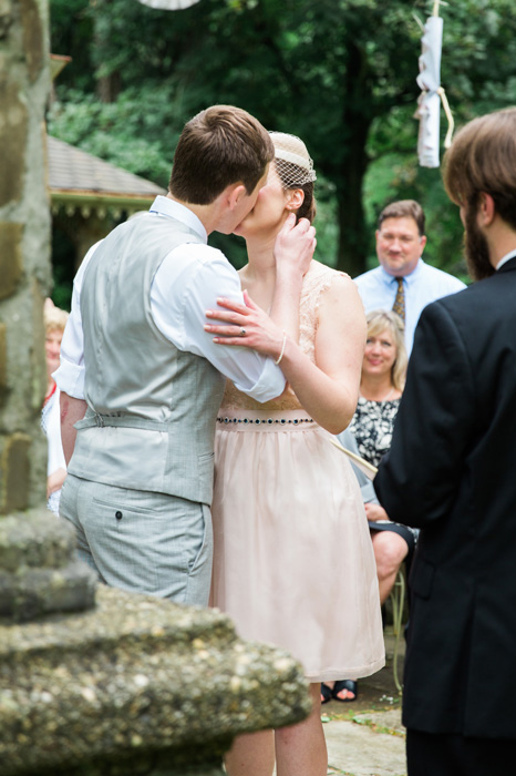 bride and groom first kiss