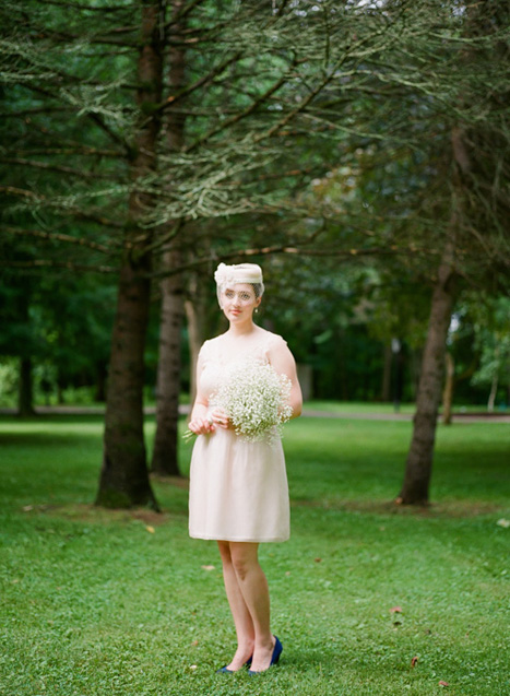 bride in pillbox hat and short wedding dress