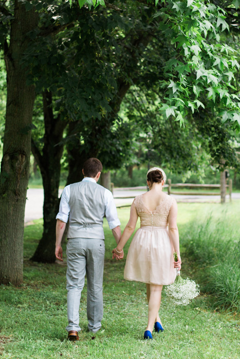 bride and groom walking away