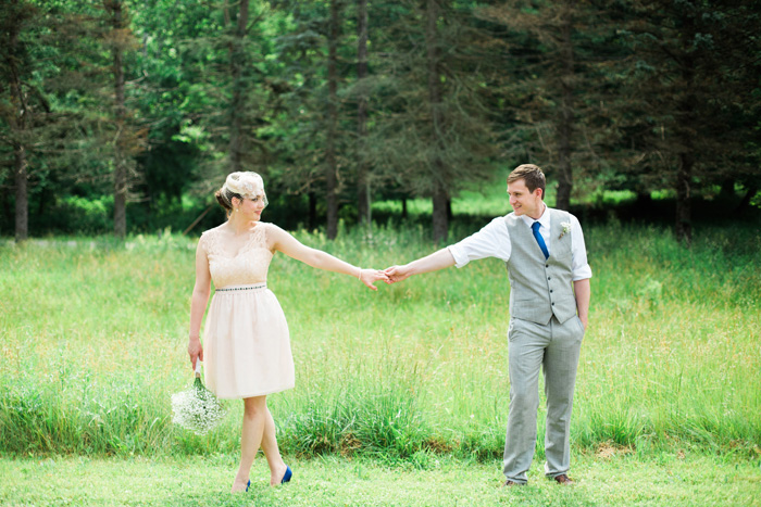 bride and groom holding hands