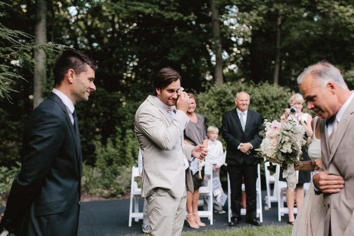 emotional groom at the altar