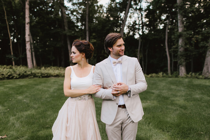 bride and groom with linked arms