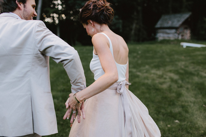 bride and groom holding hands