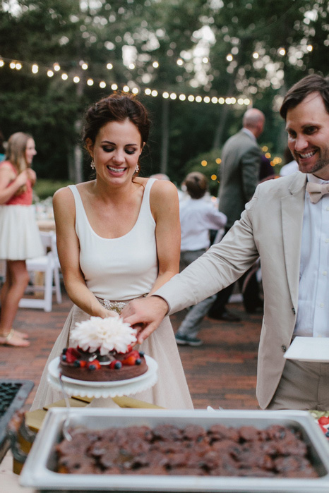 bride and groom cutting cake