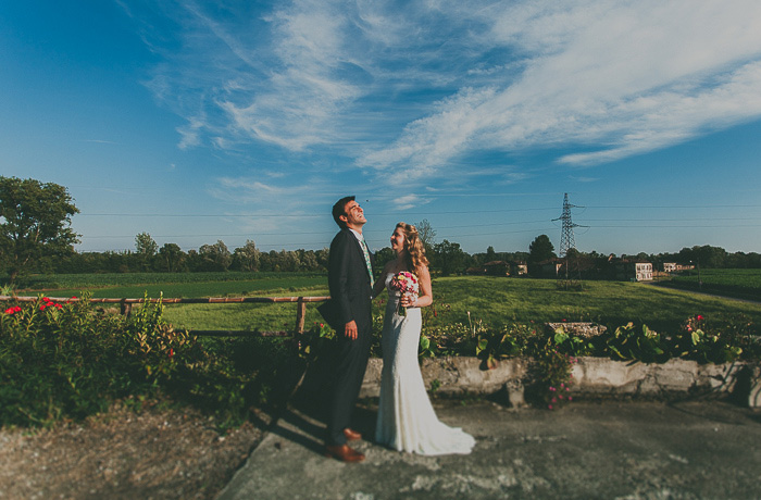 bride and groom looking up