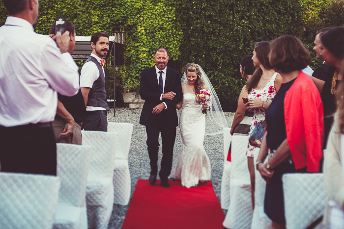 bride walking down aisle with her father