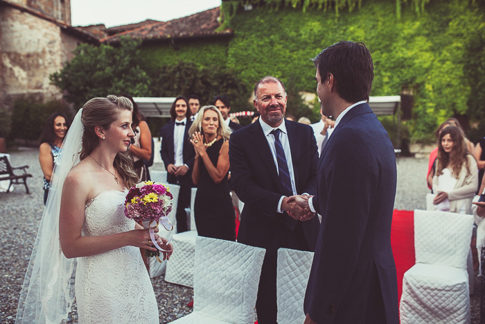 groom shaking father-in-law's hand