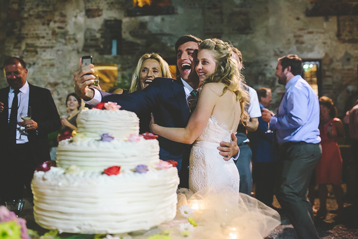 bride and groom taking selfie