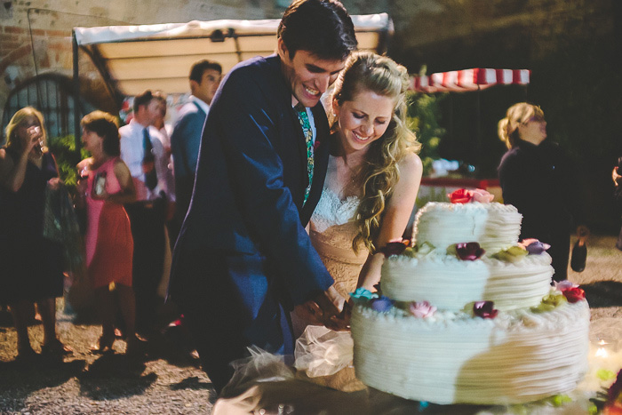 bride and groom cutting the cake