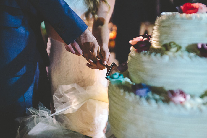 bride and groom cutting the cake