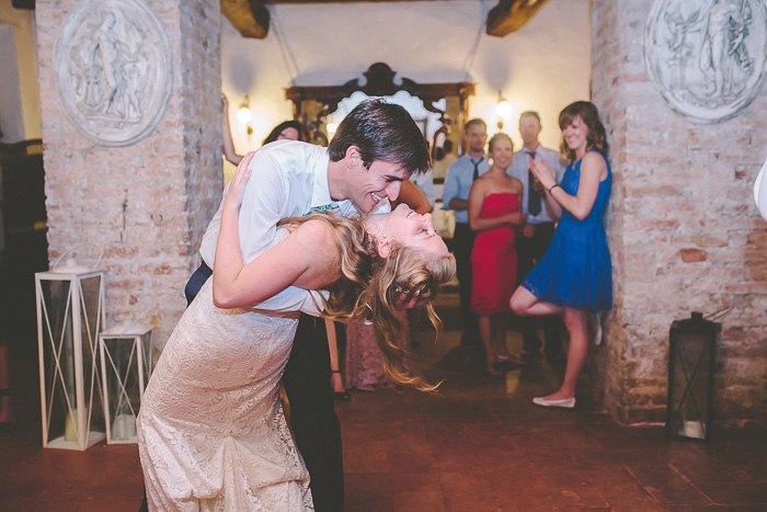 groom dipping bride