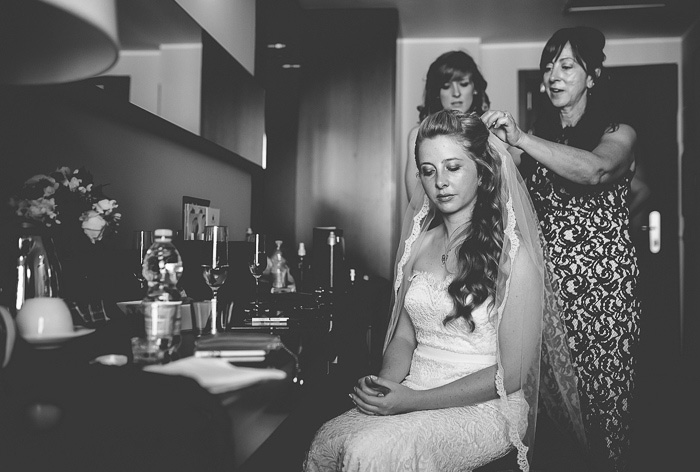 bride having her veil put on