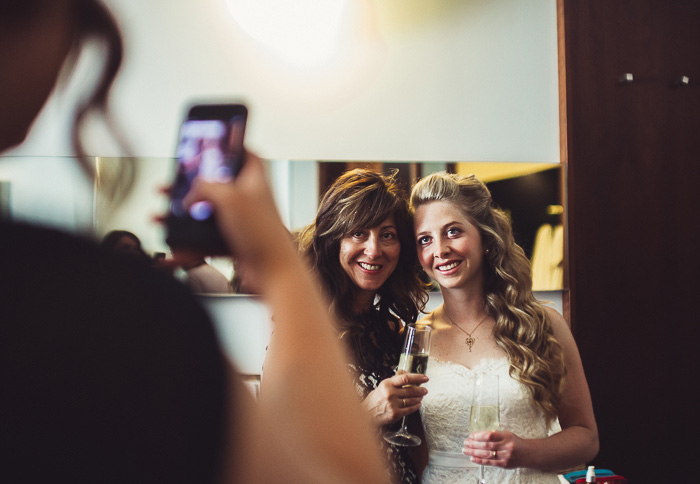 bride and mother having photo taken