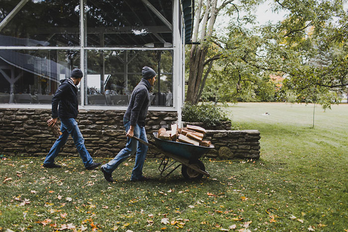 pushing wheelbarrow full of lumber