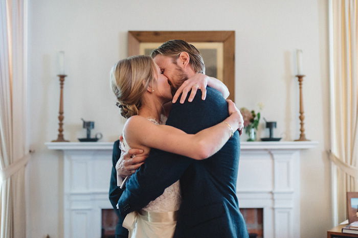 bride and groom first kiss