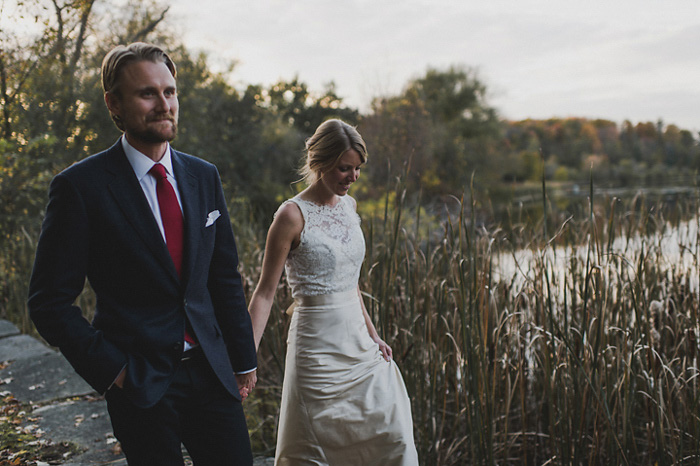 bride and groom walking in country