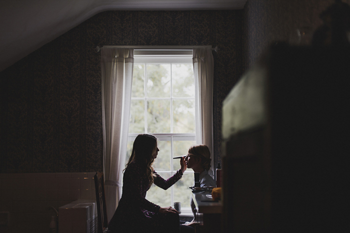 bride getting makeup done