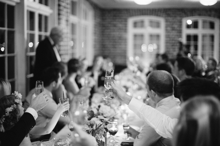 guests raising glasses