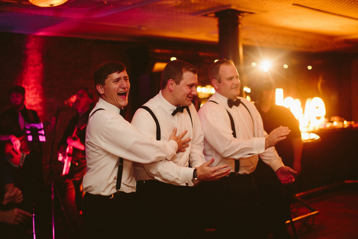 groom dancing with groomsmen