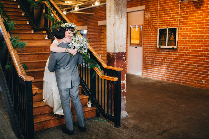 bride and groom huggin